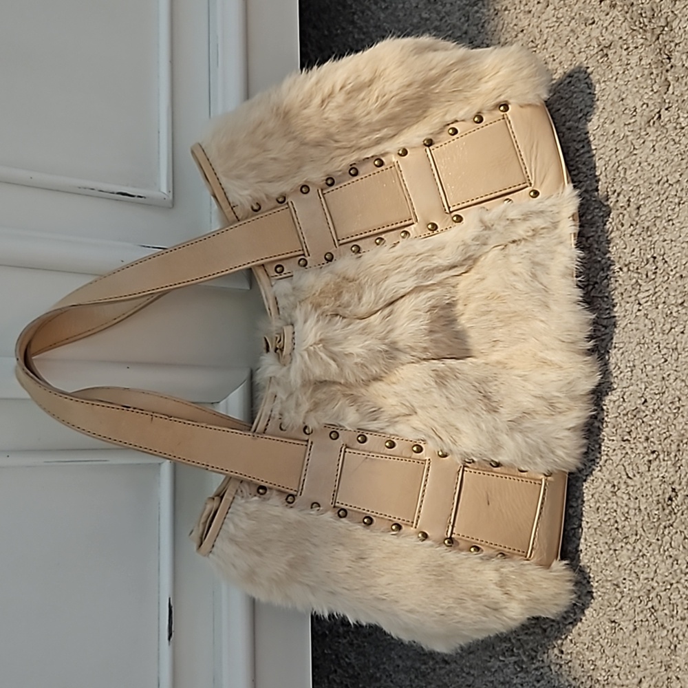 Rabbit purse  ivory,  in great condition.  Gently used .   16 " x 9 "